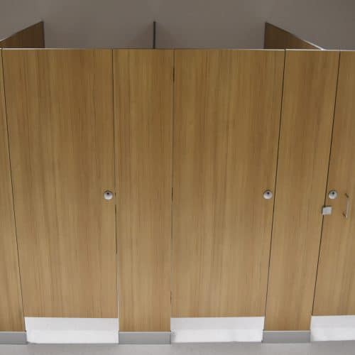 Floor-mounted toilet partitions offer stylish minimisation in commercial bathrooms.